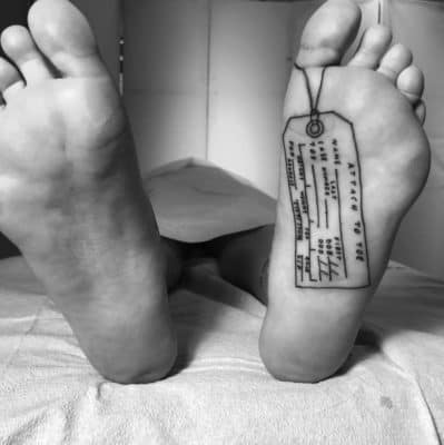 under sole morgue toe tag black and white humorous foot tattoo