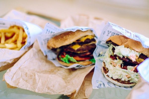 stock image of two burgers and fries street food