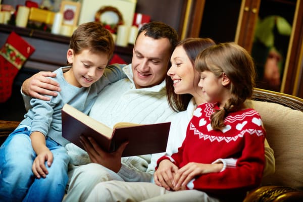 Family reading together at home