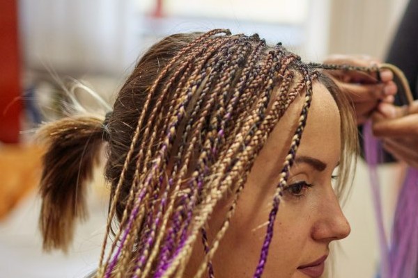 Try out colorful extensions on your hair.