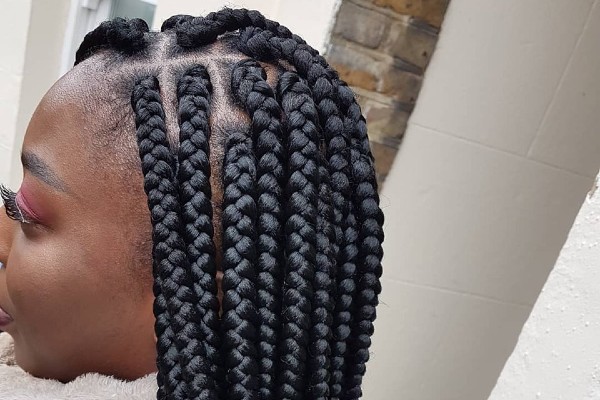 Jumbo cornrow braids for a neat look.