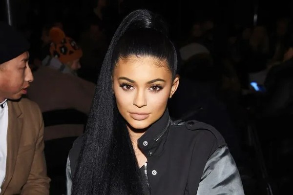 Kylie JEnner flaunts a sleek high pony.