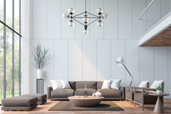 modern living room with large circular coffee table and large light hanging fixture