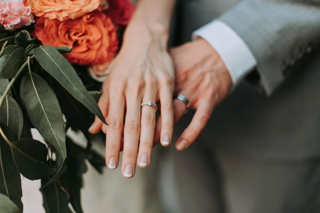 Couples holding hand while wearing Permanent Jewellery 