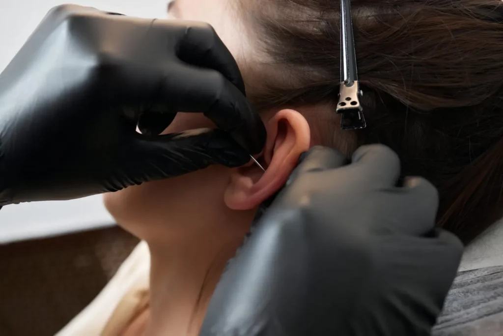 picture of a girl getting her ear pierced